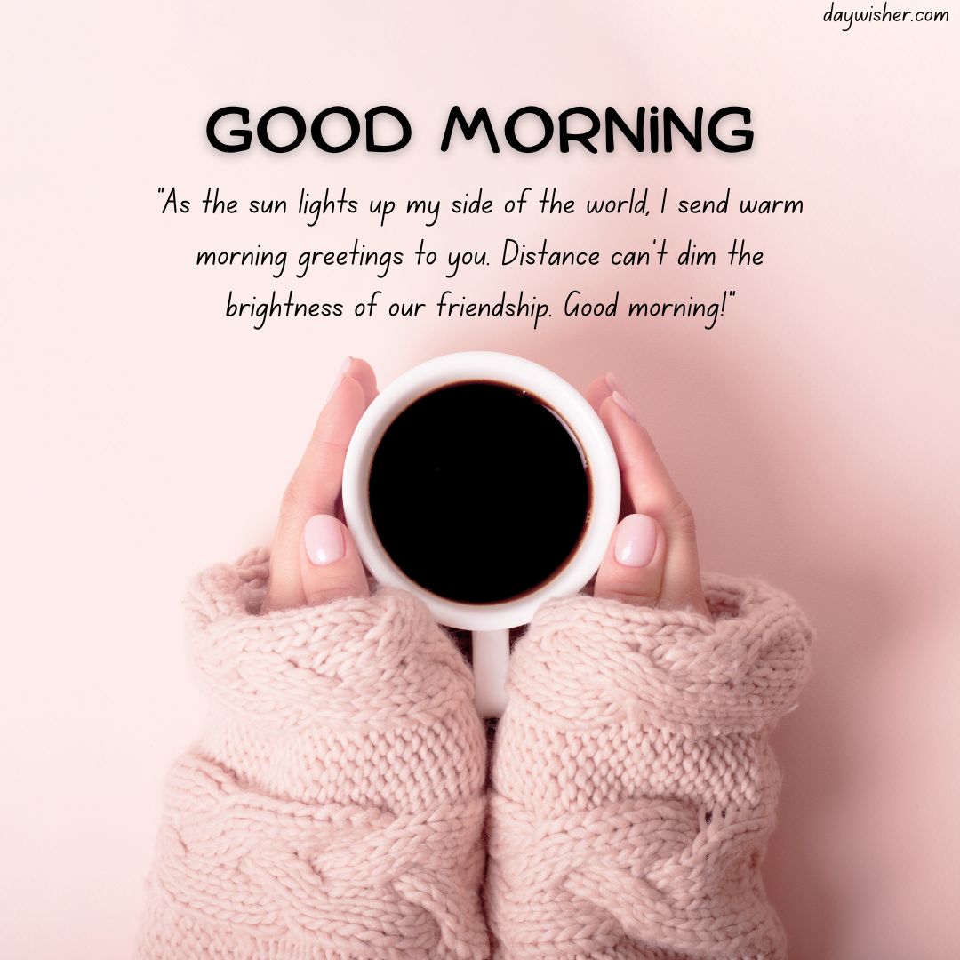 Hands clad in a pink knitted sweater holding a white mug of coffee, with a "Good Morning Messages For Friends" quote about friendship and warmth, on a soft pink background.