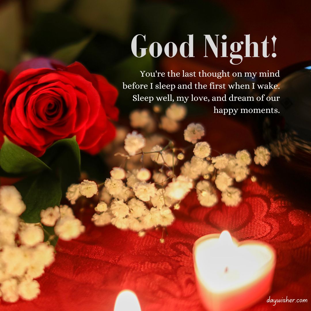 A romantic good night message for your girlfriend overlaid on an image featuring a bright red rose, delicate white baby's breath flowers, and a lit candle, all set on a dark, textured surface.