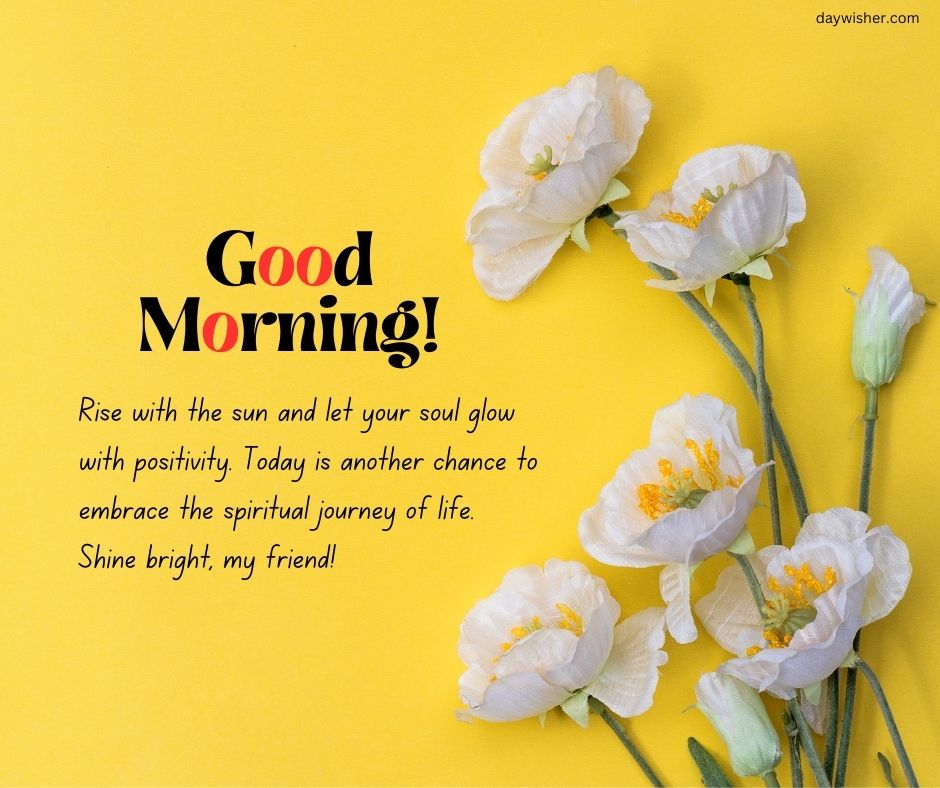 A cheerful "good morning!" greeting card featuring delicate white flowers with yellow centers on a bright yellow background, accompanied by a spiritual message about embracing the day.