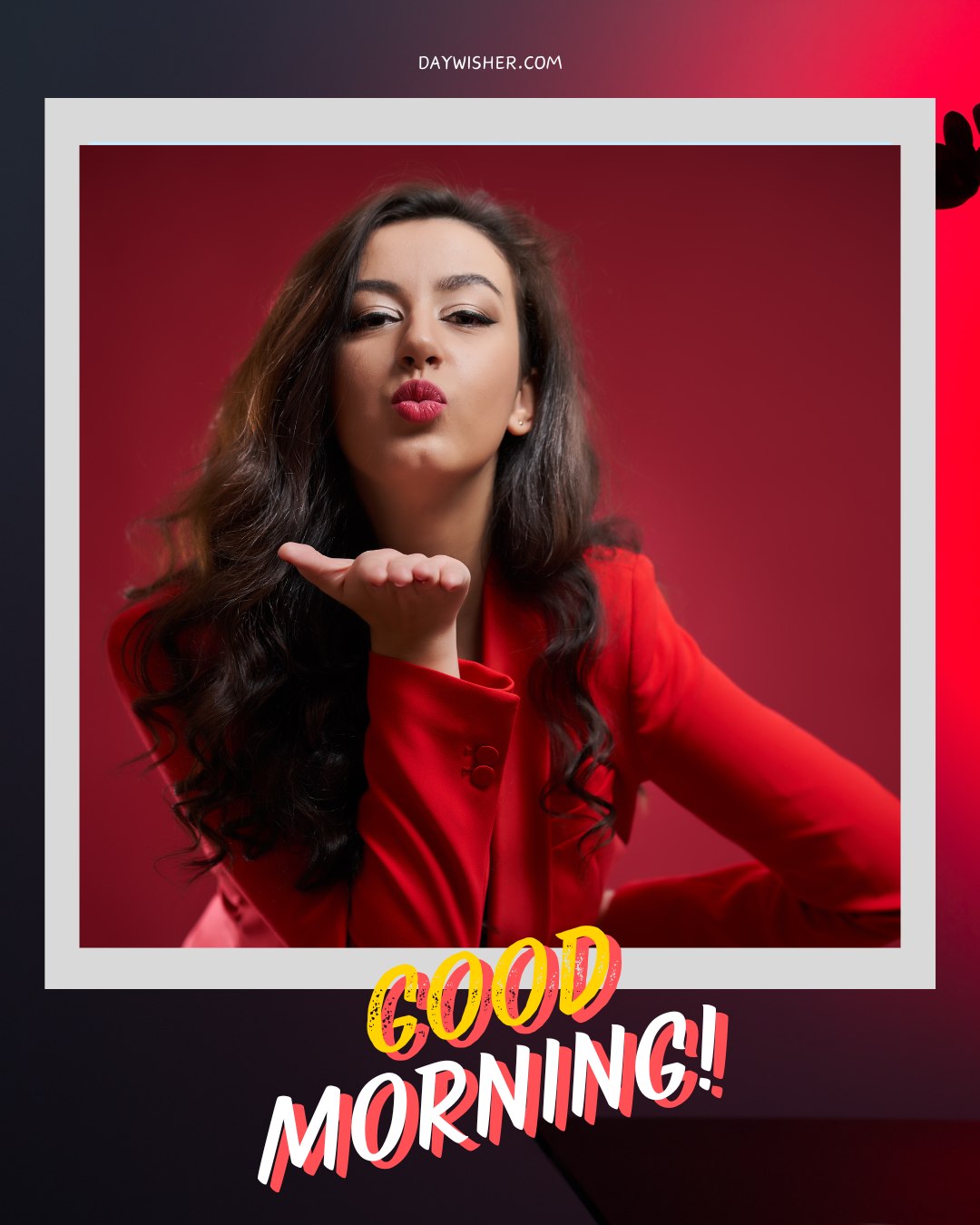 A woman with long dark hair blowing a kiss towards the camera. She is wearing a vibrant red outfit and is set against a red background. The image is framed with a white border, and "GOOD MORNING!" is written in bold, colorful letters at the bottom. The website "textwishes.com" is displayed at the top of the frame.