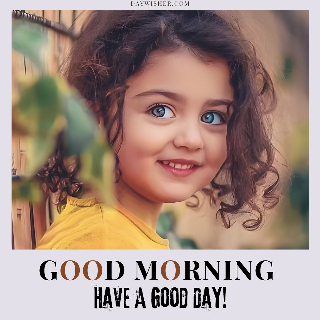 Cheerful young girl with curly hair and bright blue eyes, wearing a yellow top, smiling warmly amidst green foliage, perfect for a vibrant good morning baby greeting.