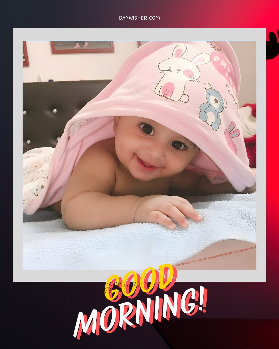 Adorable baby peeking from under a pink blanket with cartoon characters, showcasing a big, cheerful smile, perfect for a playful good morning baby greeting.