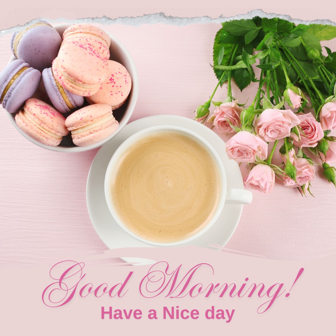 Lovely good morning coffee image featuring a white cup of creamy coffee, paired with a bowl of assorted pink and purple macarons and a bouquet of fresh pink roses, setting a delightful and elegant tone for the day.