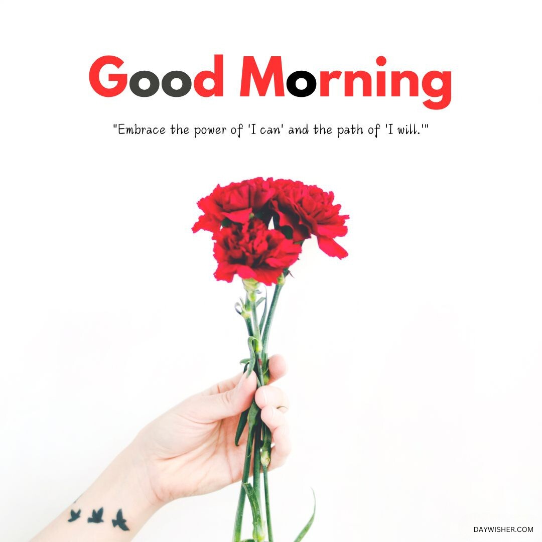 A hand holding a bouquet of vivid red carnations against a bright white background, accompanied by a motivational good morning quote, ideal for a fresh and empowering start to the day