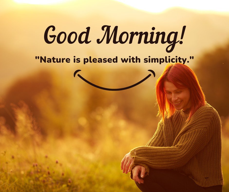 A young woman with red hair and a warm sweater smiles while sitting in a sunlit meadow. The image features the text "Good Morning! Nature is pleased with simplicity." The scene captures the calm and beauty of a simple moment in nature, ideal for good morning nature images, beautiful good morning nature images, and good morning nature images with quotes.
