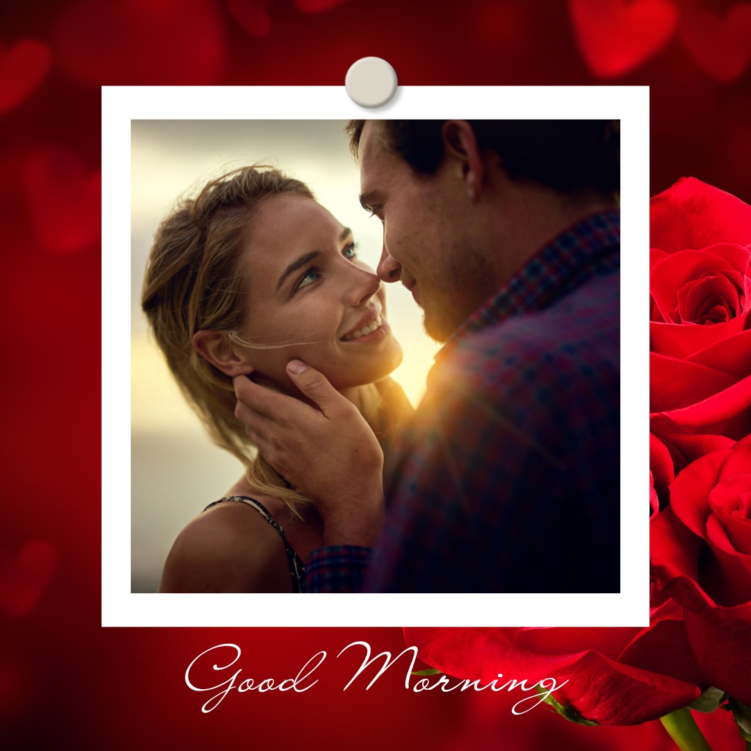 A romantic photo of a couple sharing an intimate moment, with the man gently holding the woman's face as they gaze into each other's eyes. The background features red roses and heart shapes, with the text "Good Morning" in elegant script, perfect for a loving and heartfelt morning greeting.