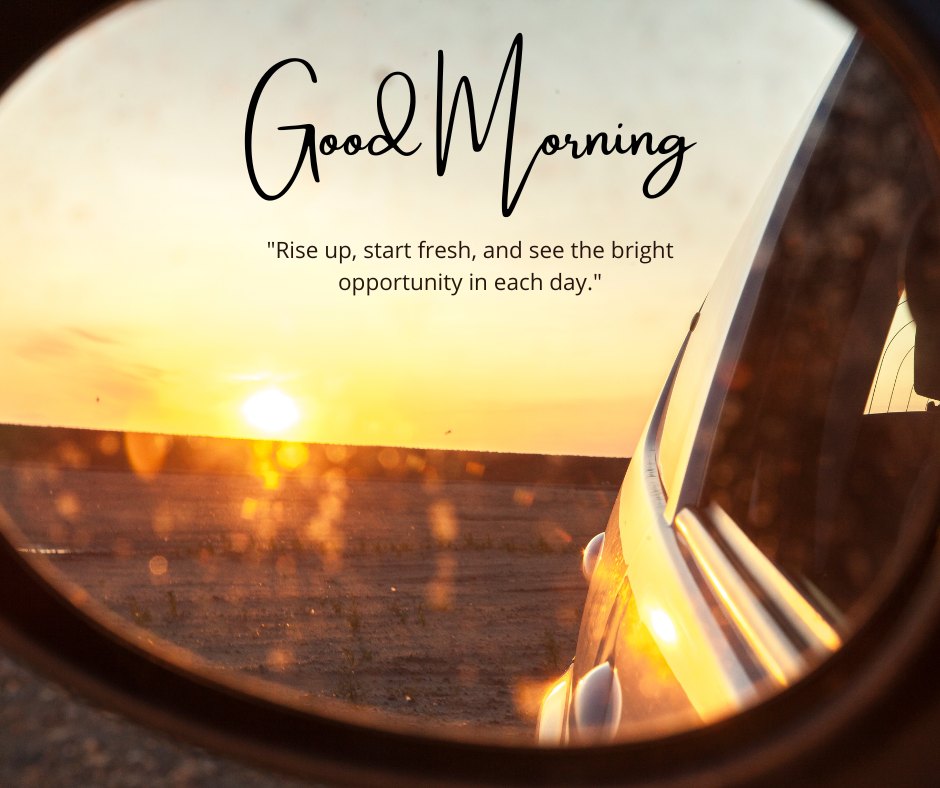 A sunrise viewed through a car's side mirror, casting a warm, golden glow over the landscape. The text "Good Morning" is displayed along with the quote "Rise up, start fresh, and see the bright opportunity in each day." This beautiful image captures the essence of a good morning with natural sunshine, perfect for sharing positivity and inspiration.