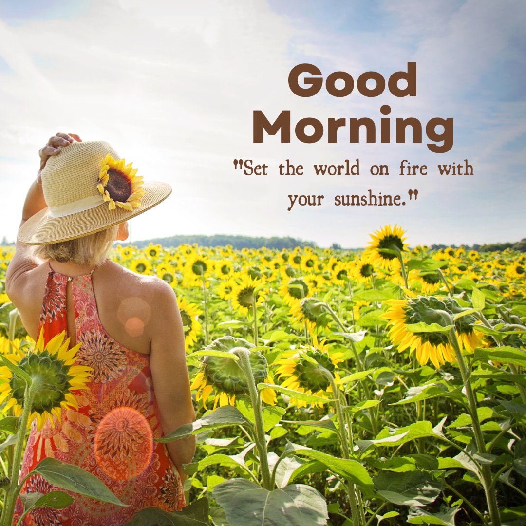 A vibrant good morning sunshine image of a woman wearing a sun hat, standing amidst a field of sunflowers under a clear blue sky. The inspiring caption "Set the world on fire with your sunshine." encourages a bold, energetic start to the day, embodying the power of positivity and brightness. This image captures the spirit of summer and the invigorating influence of sunshine, perfect for inspiring motivation and joy in the morning.