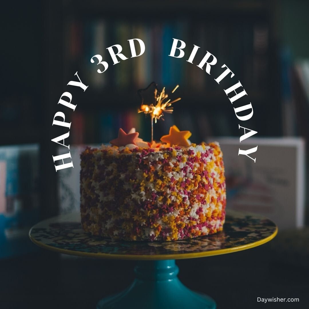A colorful birthday cake with "Happy 3rd Birthday" written on it, decorated with sparklers and edible stars, displayed on a teal cake stand with blurred books in the background. Suitable for both