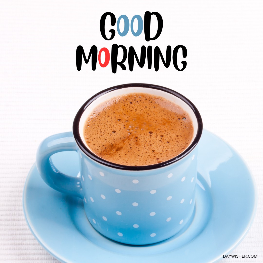 A charming blue coffee cup with white polka dots filled with steaming coffee, presented on a light blue saucer. The bold "Good Morning" text above the cup adds a cheerful note, making this image a wonderful selection for those seeking good morning coffee images that start the day with a playful and bright mood.