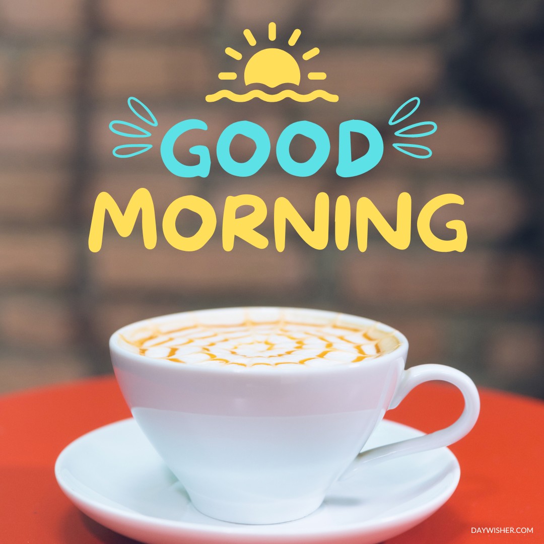 A white coffee cup on a red table showcasing intricate latte art, with a bright "Good Morning" greeting and a stylized sun illustration above. A delightful way to start the day.