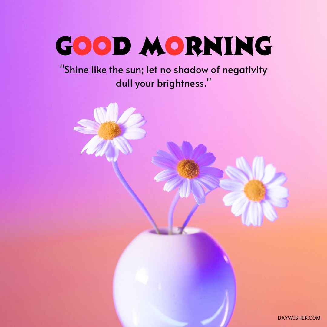 A vibrant Good Morning Flowers image featuring three daisies in a small vase against a purple and pink gradient background. The text "good morning" and a motivational quote about positivity are included.