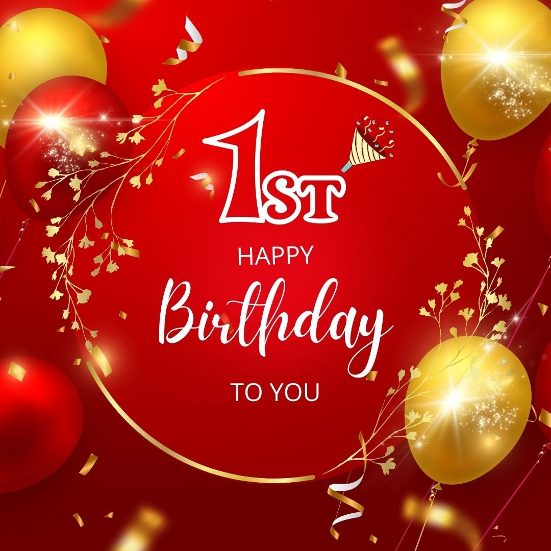 A festive 1st birthday greeting card with the message "happy 1st birthday to you" in white text surrounded by red and gold balloons, gold confetti, and streamers on a red