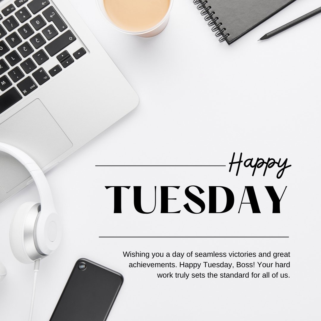 Professional Happy Tuesday setup featuring a laptop, headphones, a notebook, pen, and a cup of coffee on a clean white desk, with a message wishing a great boss a day of seamless victories and achievements