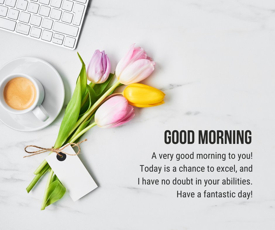 Motivational good morning message for an important day featuring a cup of espresso, a bouquet of tulips, and a keyboard on a marble background, encouraging excellence and confidence.