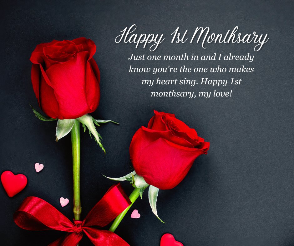 Happy 1st Monthsary message for boyfriend featuring two red roses with a red ribbon, heart decorations, and the message 'Just one month in and I already know you're the one who makes my heart sing. Happy 1st monthsary, my love!